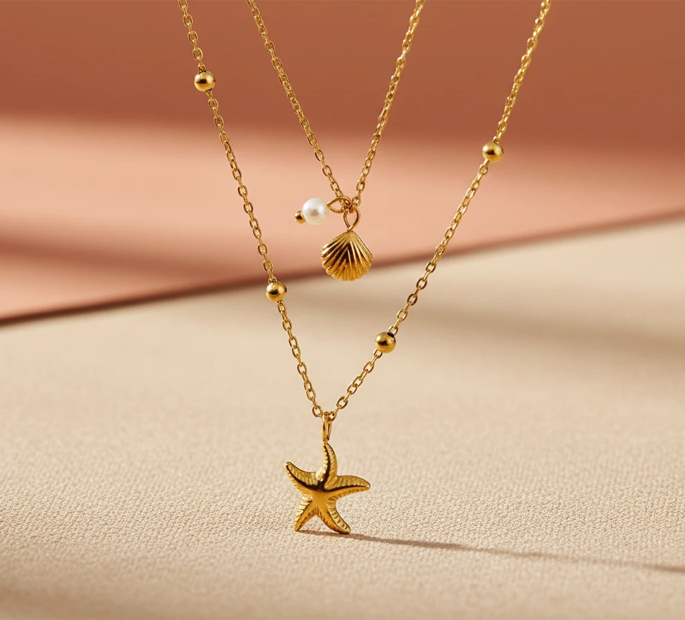 COLLAR DOS EN 1 CON DIJE DE ESTRELLA Y CONCHA DE MAR